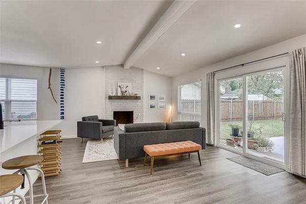 Fireplace, Interior, Living room, Recessed Lighting, Stone Walls, Wood Texture Flooring