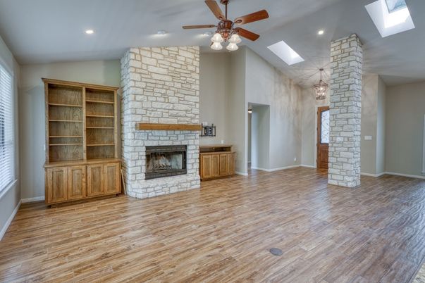 Empty room, Fireplace, Interior, Pendant Lights, Recessed Lighting, Stone Walls, Wood Texture Flooring