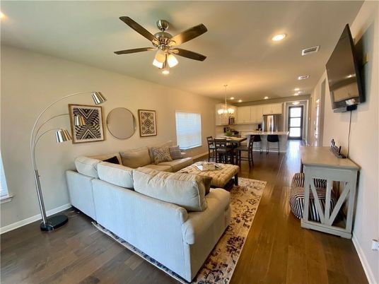Chandelier, Dining room, Interior, Kitchen, Living room, Pendant Lights, Recessed Lighting, Stainless Steel Appliances, Wood Texture Flooring
