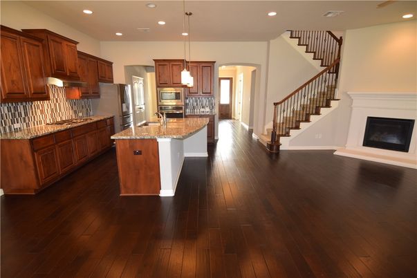 Fireplace, Interior, Kitchen, Pendant Lights, Recessed Lighting, Stainless Steel Appliances, Wood Texture Flooring
