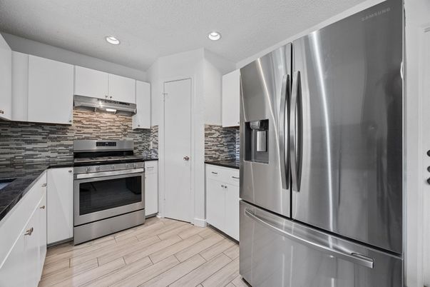 Interior, Kitchen, Recessed Lighting, Stainless Steel Appliances, Wood Texture Flooring