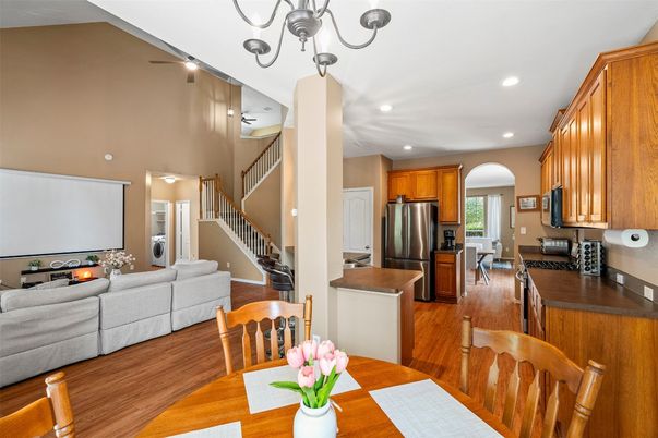 Chandelier, Dining room, Interior, Kitchen, Living room, Recessed Lighting, Stainless Steel Appliances, Wood Texture Flooring