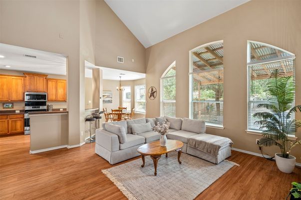 Chandelier, Dining room, Interior, Kitchen, Living room, Pendant Lights, Recessed Lighting, Stainless Steel Appliances, Wood Texture Flooring