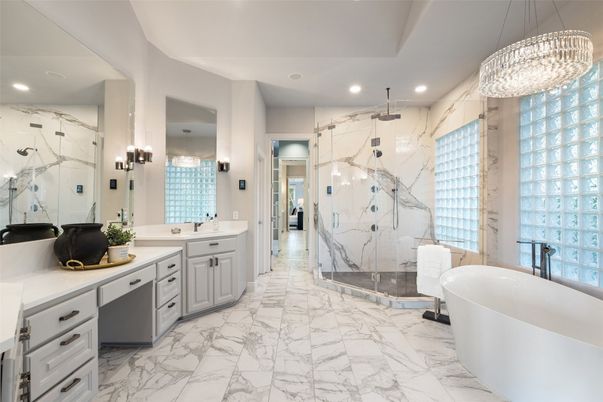 Bathroom, Chandelier, Dual Sink Vanities, Free Standing Baths, Glass Shower, Interior, Marble, Marble Walls, Pendant Lights, Recessed Lighting