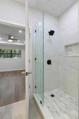 Bathroom, Glass Shower, Interior, Marble Walls, Recessed Lighting, Wood Texture Flooring
