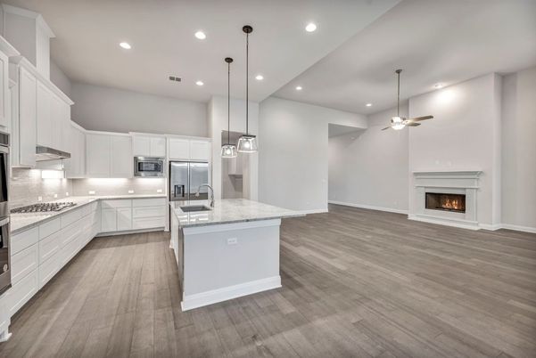 Fireplace, Interior, Kitchen, Pendant Lights, Recessed Lighting, Stainless Steel Appliances, Wood Texture Flooring