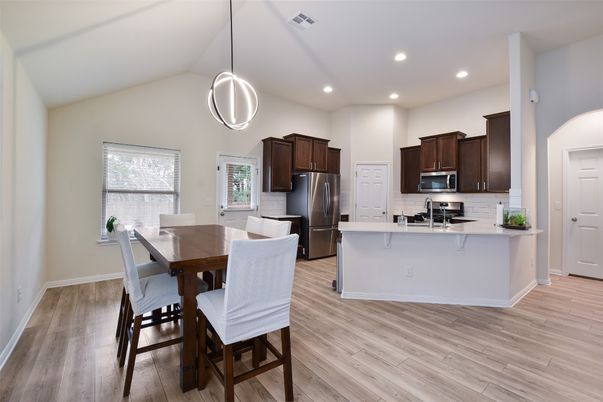 Dining room, Interior, Kitchen, Pendant Lights, Recessed Lighting, Stainless Steel Appliances, Wood Texture Flooring