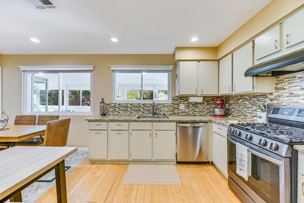Dining room, Interior, Kitchen, Recessed Lighting, Stainless Steel Appliances, Wood Texture Flooring