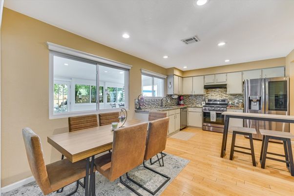 Dining room, Interior, Kitchen, Recessed Lighting, Stainless Steel Appliances, Wood Texture Flooring