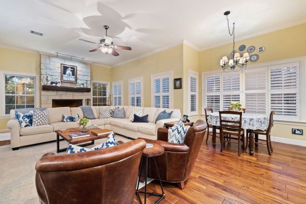 Chandelier, Dining room, Fireplace, Interior, Living room, Stone Walls, Wood Texture Flooring