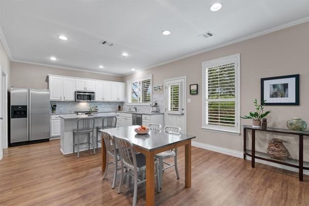 Dining room, Interior, Kitchen, Recessed Lighting, Stainless Steel Appliances, Wood Texture Flooring