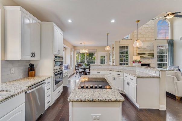 Dining room, Interior, Kitchen, Pendant Lights, Recessed Lighting, Stainless Steel Appliances, Wood Texture Flooring