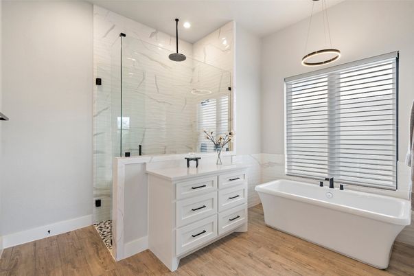 Bathroom, Free Standing Baths, Glass Shower, Interior, Marble Walls, Pendant Lights, Recessed Lighting, Wood Texture Flooring