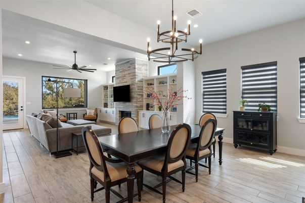 Dining room, Fireplace, Interior, Living room, Pendant Lights, Recessed Lighting, Stone Walls, Wood Texture Flooring