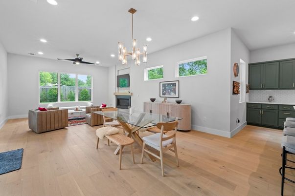Dining room, Fireplace, Interior, Living room, Pendant Lights, Recessed Lighting, Wood Texture Flooring