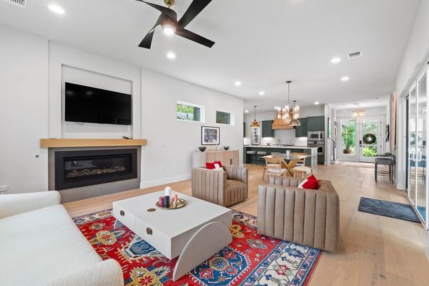 Fireplace, Interior, Kitchen, Living room, Pendant Lights, Recessed Lighting, Stainless Steel Appliances, Wood Texture Flooring