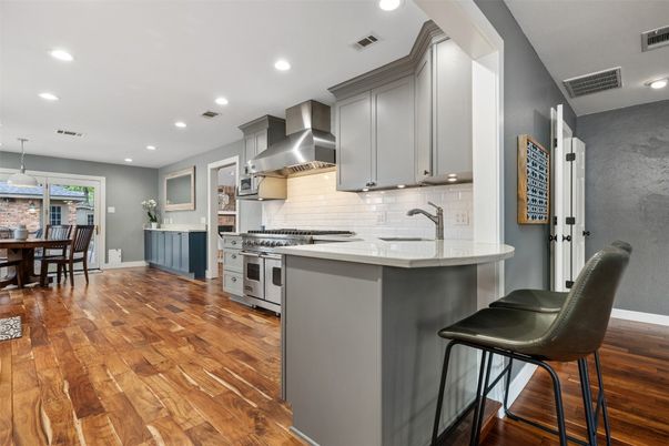 Dining room, Interior, Kitchen, Pendant Lights, Recessed Lighting, Stainless Steel Appliances, Wood Texture Flooring