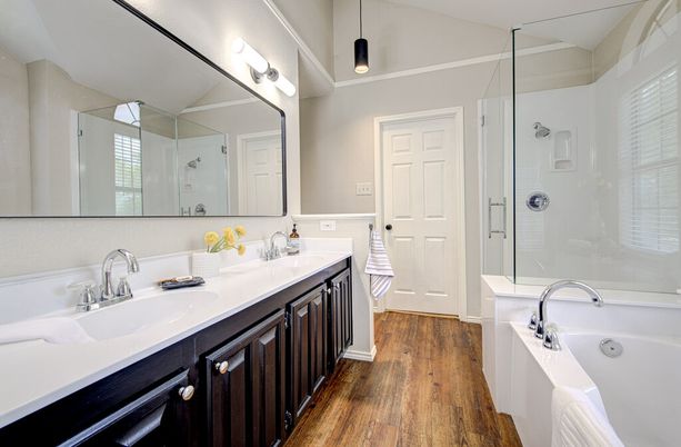 Bathroom, Dual Sink Vanities, Glass Shower, Interior, Pendant Lights, Wood Texture Flooring