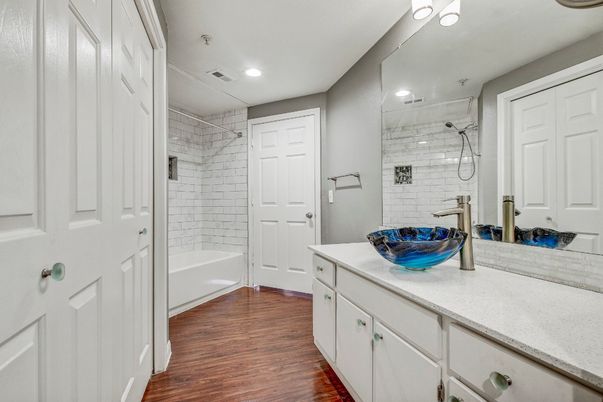 Bathroom, Dual Sink Vanities, Glass Shower, Interior, Recessed Lighting, Wood Texture Flooring