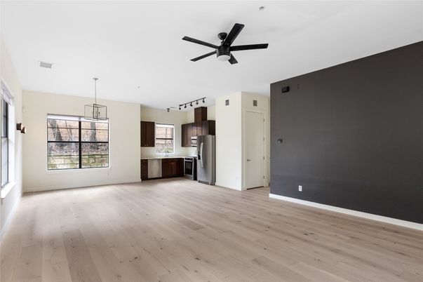 Empty room, Interior, Kitchen, Pendant Lights, Stainless Steel Appliances, Wood Texture Flooring