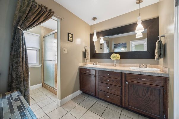 Bathroom, Dual Sink Vanities, Glass Shower, Interior, Pendant Lights, Tile Countertops