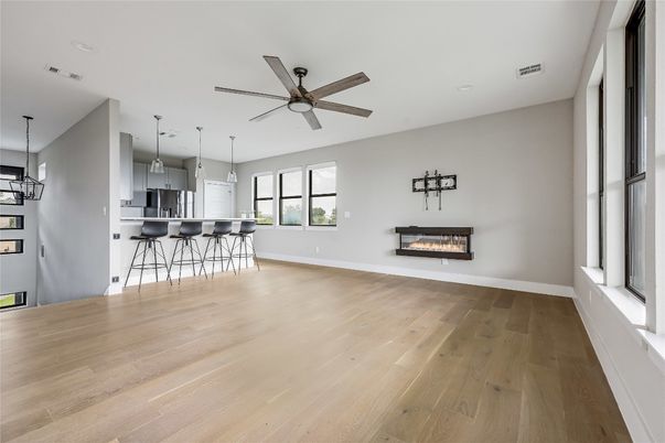 Empty room, Fireplace, Interior, Kitchen, Pendant Lights, Recessed Lighting, Wood Texture Flooring