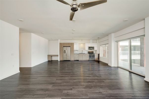 Empty room, Interior, Kitchen, Pendant Lights, Recessed Lighting, Stainless Steel Appliances, Wood Texture Flooring