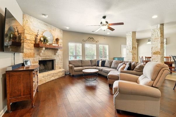 Fireplace, Interior, Living room, Recessed Lighting, Stone Walls, Wood Texture Flooring