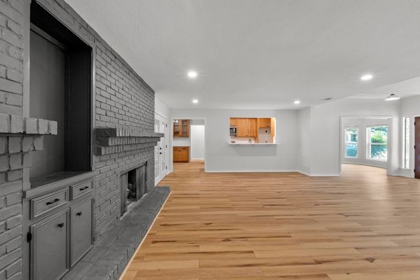 Empty room, Fireplace, Interior, Recessed Lighting, Stone Walls, Wood Texture Flooring