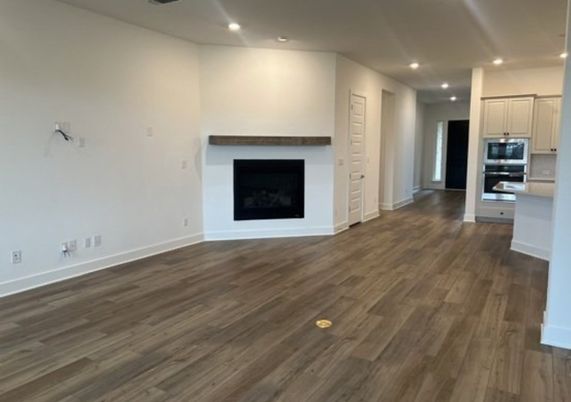 Empty room, Fireplace, Interior, Kitchen, Recessed Lighting, Wood Texture Flooring