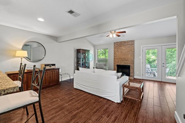 Fireplace, Interior, Living room, Recessed Lighting, Stone Walls, Wood Texture Flooring