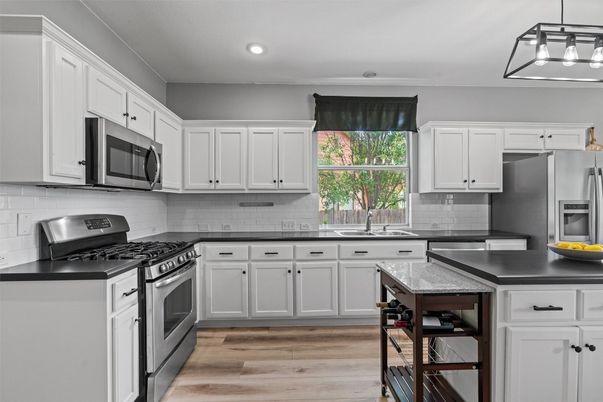 Interior, Kitchen, Pendant Lights, Recessed Lighting, Stainless Steel Appliances, Wood Texture Flooring