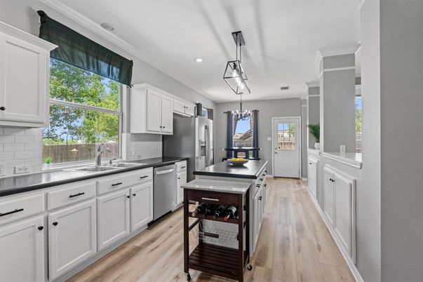 Chandelier, Interior, Kitchen, Pendant Lights, Recessed Lighting, Stainless Steel Appliances, Wood Texture Flooring
