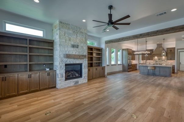 Empty room, Fireplace, Interior, Kitchen, Pendant Lights, Recessed Lighting, Stone Walls, Wood Texture Flooring