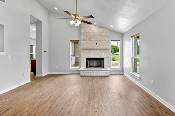 Empty room, Fireplace, Interior, Recessed Lighting, Stone Walls, Wood Texture Flooring