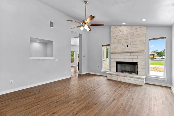 Empty room, Fireplace, Interior, Recessed Lighting, Stone Walls, Wood Texture Flooring