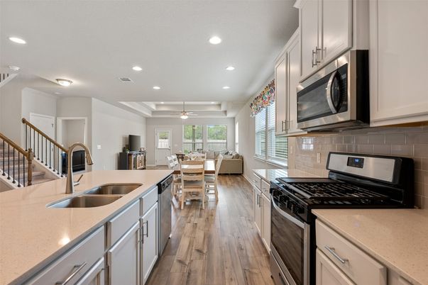 Dining room, Interior, Kitchen, Living room, Recessed Lighting, Stainless Steel Appliances, Wood Texture Flooring