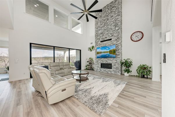 Fireplace, Interior, Living room, Recessed Lighting, Stone Walls, Wood Texture Flooring