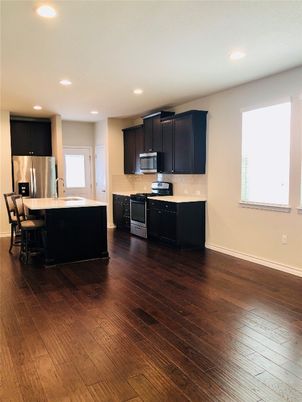 Dining room, Interior, Kitchen, Recessed Lighting, Stainless Steel Appliances, Wood Texture Flooring