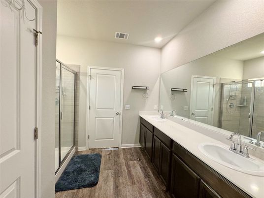 Bathroom, Dual Sink Vanities, Glass Shower, Interior, Recessed Lighting, Wood Texture Flooring