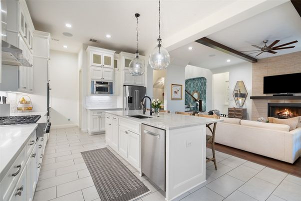 Fireplace, Interior, Kitchen, Living room, Pendant Lights, Recessed Lighting, Stainless Steel Appliances, Stone Walls