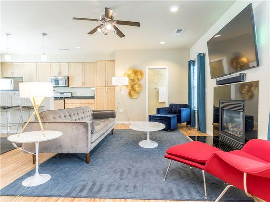 Fireplace, Interior, Kitchen, Living room, Pendant Lights, Recessed Lighting, Stainless Steel Appliances, Wood Texture Flooring
