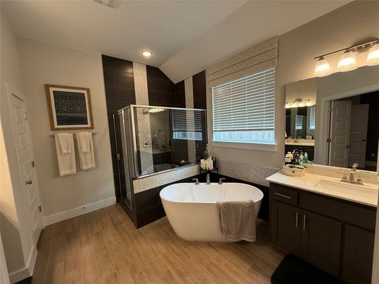 Bathroom, Dual Sink Vanities, Free Standing Baths, Glass Shower, Interior, Recessed Lighting, Wood Texture Flooring