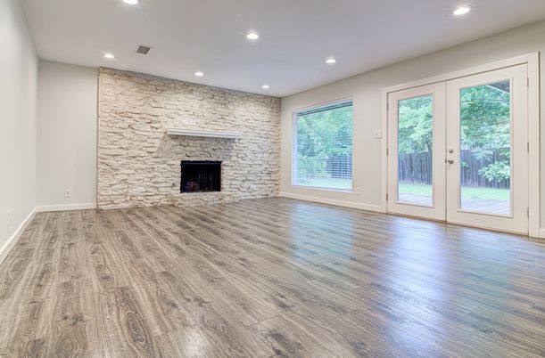 Empty room, Fireplace, Interior, Recessed Lighting, Stone Walls, Wood Texture Flooring