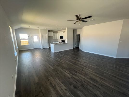Empty room, Interior, Kitchen, Pendant Lights, Recessed Lighting, Stainless Steel Appliances, Wood Texture Flooring
