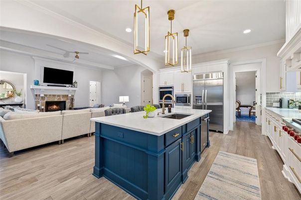 Fireplace, Interior, Kitchen, Living room, Pendant Lights, Recessed Lighting, Stainless Steel Appliances, Wood Texture Flooring