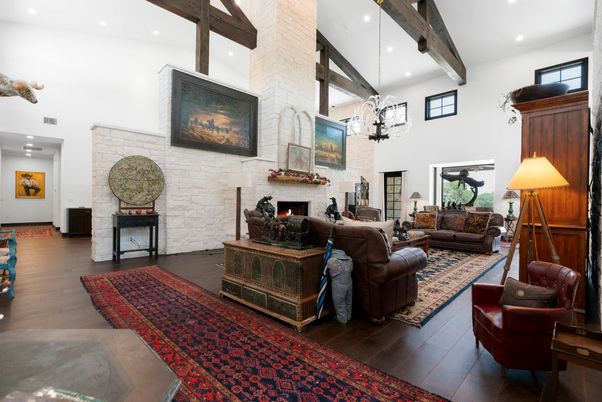 Chandelier, Fireplace, Interior, Living room, Recessed Lighting, Stone Walls, Wooden Beams, Wood Texture Flooring