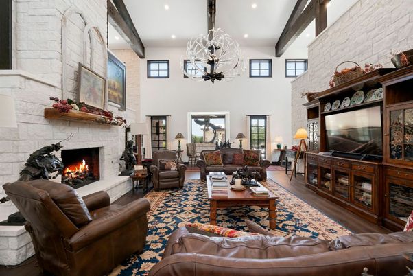 Chandelier, Fireplace, Interior, Living room, Recessed Lighting, Stone Walls, Wooden Beams, Wood Texture Flooring