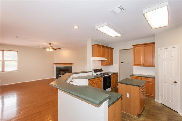 Fireplace, Interior, Kitchen, Recessed Lighting, Wood Texture Flooring