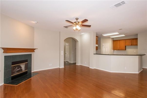 Empty room, Fireplace, Interior, Kitchen, Recessed Lighting, Wood Texture Flooring